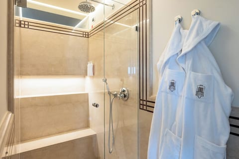 Family Suite | Bathroom | Hair dryer, slippers, towels, soap