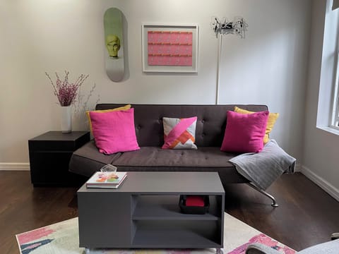 Living room with fold down couch into Full XL size bed