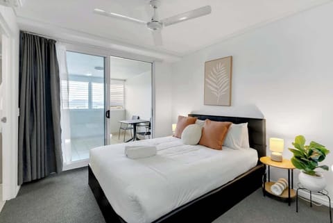 Rest easy in a queen bed surrounded by natural light, with direct access to a private sunroom for extra space and quiet moments.