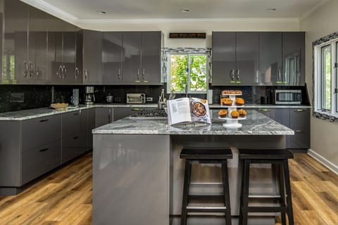 Kitchen l Fully Equipped with Island Seating (Pastries not included)