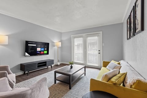 Bright modern living space with a cozy sofa for a relaxing stay.