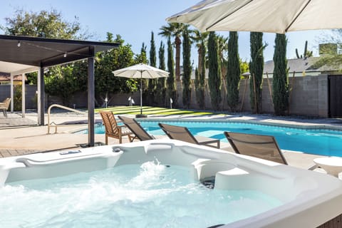 Shaded hot tub overlooking the pool