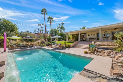Bask in the sunshine beside your private pool, surrounded by palm trees and desert charm