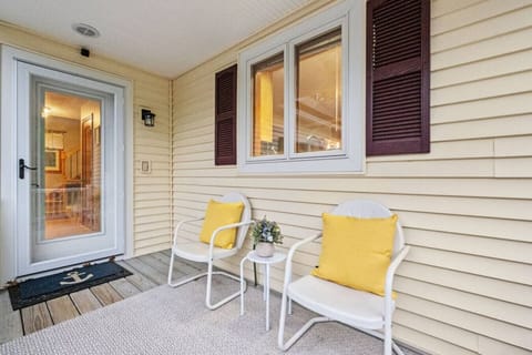 Cozy covered porch seating—perfect for enjoying a quiet moment no matter the weather.