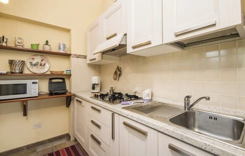 Apartment, Garden View | Private kitchen | Fridge, microwave, stovetop, espresso maker