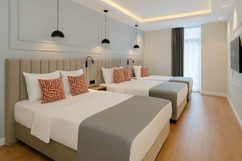 Quadruple Room | Minibar, in-room safe, soundproofing, iron/ironing board