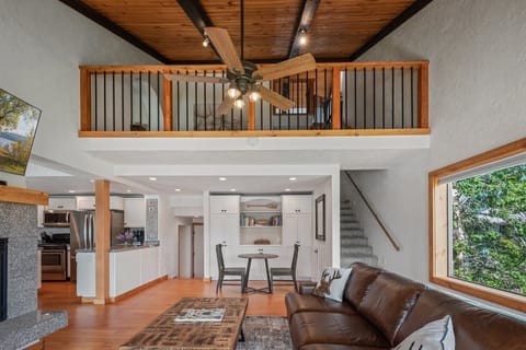 view from living room to loft area (fireplace has recently been renovated)