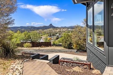 - Hillside patio overlooking mountain views and bright desert scenery - Peaceful outdoor path with stone walkway and open-air seating - Scenic retreat ideal for relaxing moments and sunrise watching