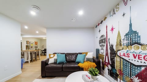 Cozy lounge with bold Vegas mural—perfect for relaxing nights