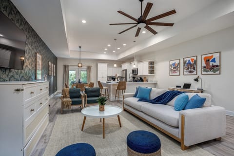 Open floor plan concept featuring living room, dining area, and kitchen