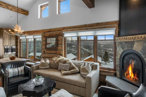 Luxury and views at every turn! Living room with gas fireplace, large Smart TV.