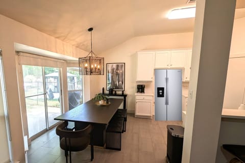 Large dining room next to the kitchen. Note that this picture was taken before the new refrigerator was delivered so we edited the picture for now.