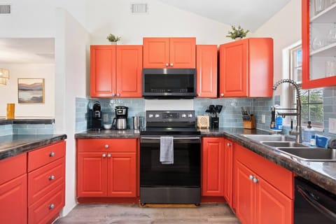 Cook in style! Our fully stocked kitchen features a large island, high-end appliances, and ample cabinetry for all your culinary creations.