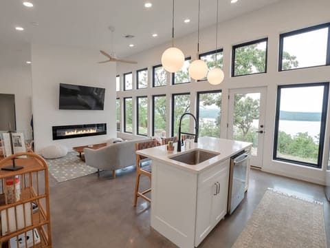 Open floorplan with electric fireplace and smart TV