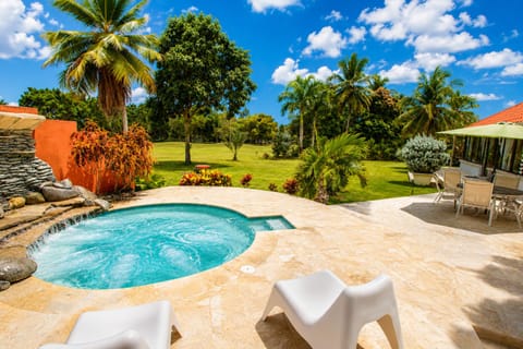 Patio Oasis: Relax in your private hot tub with stunning garden views and tropical vibes!
