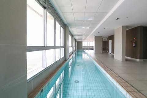 Indoor pool, outdoor pool, pool umbrellas, sun loungers