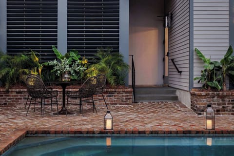 Shared Pool | Heated In Ground Pool | Shared with Other Suites | Garden Level of Building