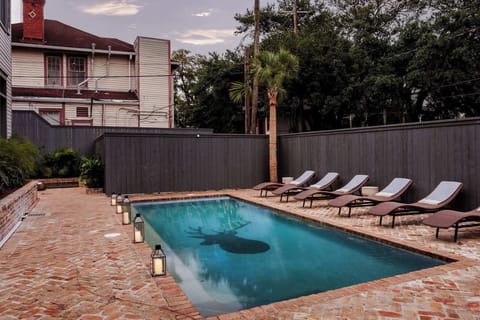 Shared Pool | Heated In Ground Pool | Shared with Other Suites | Garden Level of Building