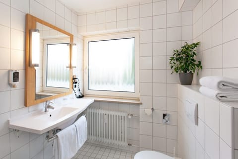 Deep soaking tub, rainfall showerhead, hair dryer, towels