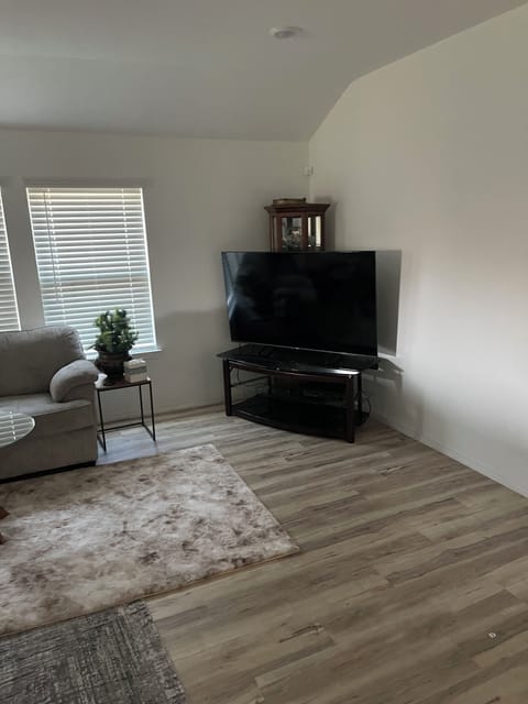 60" TV faces living, dining, office, master and kitchen.