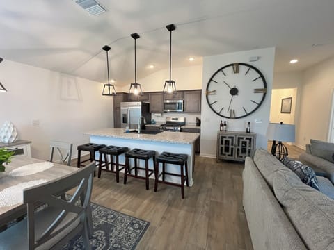 There is a desk with office supplies and a printer for your use.