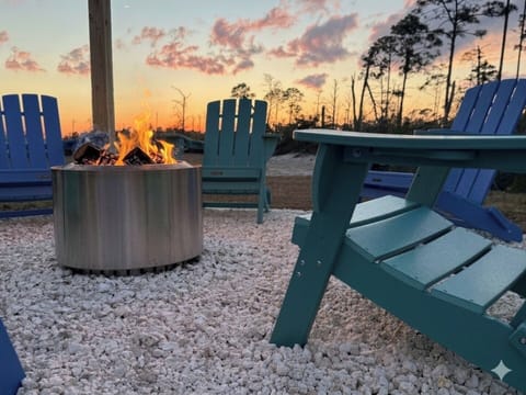 Gas grill (not shown) and smokeless firepit with Adirondack chairs for cozy outdoor hangs.