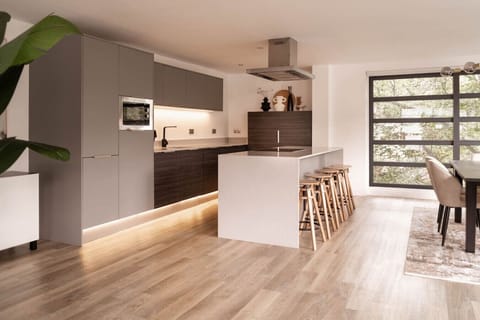 Kitchen - Gather around with your friends and family.  The kitchen features a huge island so you can whip up a breakfast in the morning or make a few cocktails at night.  Integrated lighting sets the mood and compliments the contemporary kitchen.