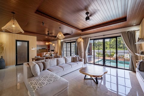 Deluxe Villa, 2 Bedrooms, Patio, Pool View | Living room | 50-inch TV with cable channels