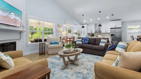 The seating area opens right up to the kitchen + two separate dining areas.