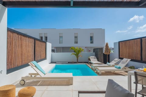 Private pool area with sunbeds to enjoy the sun.