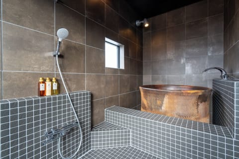 Deluxe Apartment | Bathroom | Free toiletries, hair dryer, slippers, electronic bidet
