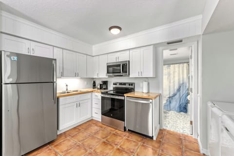 Holmes Hideaway with sleek counters and stainless appliances make it easy to prep meals, snacks, or margaritas—whatever the moment calls for.