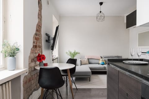 Open-plan living space with warm lighting and a calming neutral palette for a true home-away-from-home.