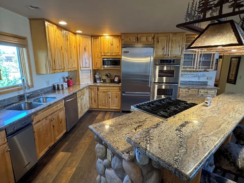With a gas cooktop, double oven, even a trash compactor this kitchen has it all!