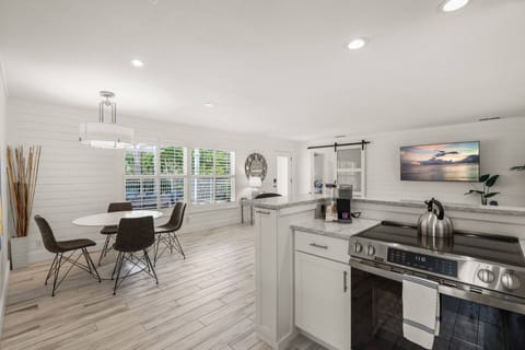 Gather, laugh, and enjoy a meal together in this inviting dining space.