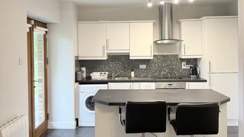 Fully equipped kitchen with appliances, perfect for home-style cooking.