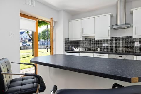 Sunlit kitchen with easy outdoor access.