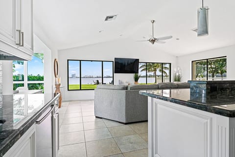 Modern, open-plan living area with a sleek kitchen island and stunning views, perfect for socializing.