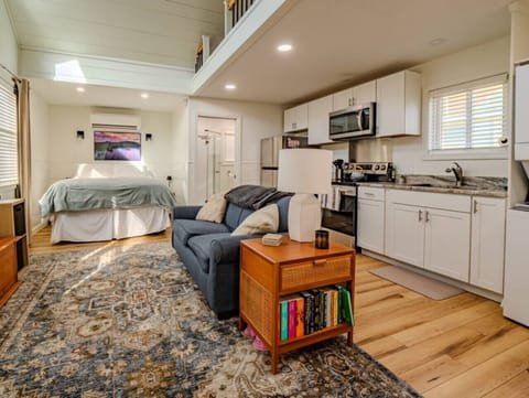 Inside of cabin- open concept- bedroom, living room, and kitchen