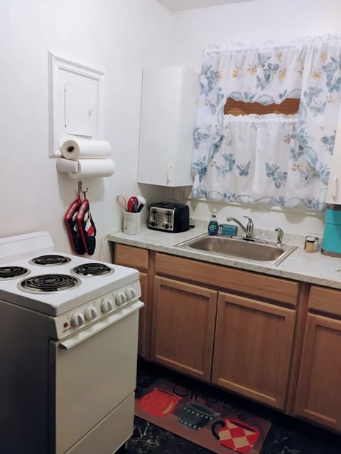 Kitchen  with  stove  & refrigerator 