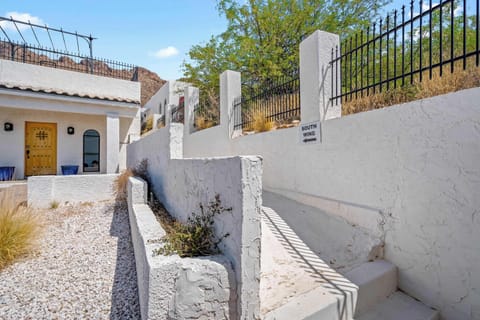 Follow the charming garden path and step into your own peaceful retreat tucked against the desert hillside.
