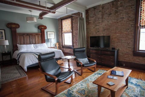 Loft has privacy curtain to separate spaces & comfortably sleeps four guests.