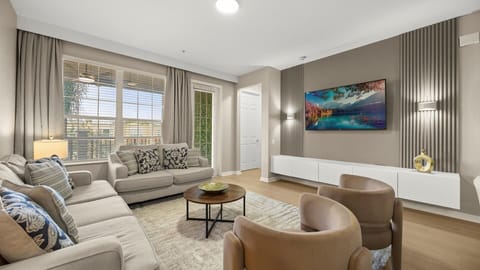 Modern Living Room Retreat – A bright, stylish lounge with plush seating and a large Smart TV for relaxing nights in.