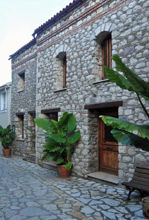 Traditional Stone Apartment Exterior – Authentic façade with rustic charm and traditional Greek stonework.