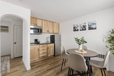 Bright, open layout with dining space and fully equipped kitchenette.