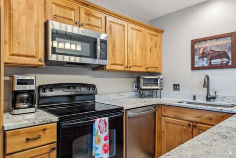 Kitchen: Drip coffee maker, Crockpot, blender, toaster, kettle, cooking utensils, tableware