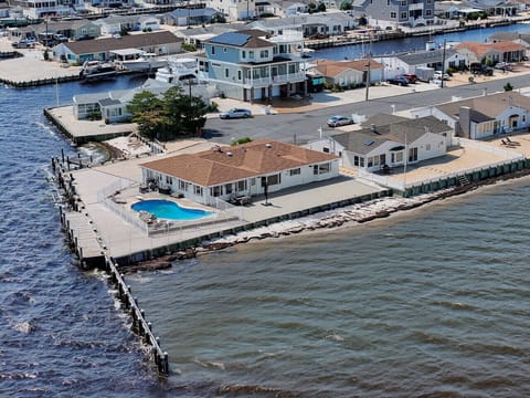 Amazing corner lot home on the bay with pool.