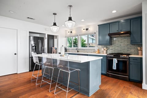 Beautifully updated kitchen with additional seating at the island bar.