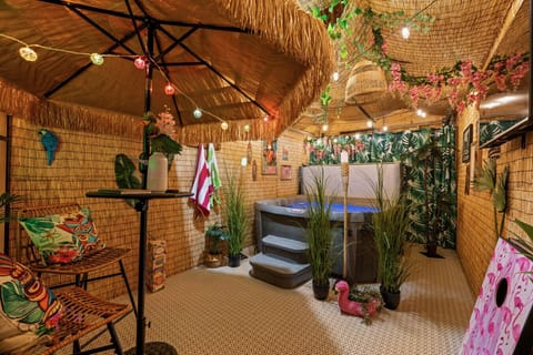 Unwind and connect in our shared tropical hot tub haven, a bubbly escape with island vibes.