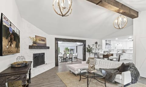 Gorgeous open living room number one with large screen TV comfortable seating